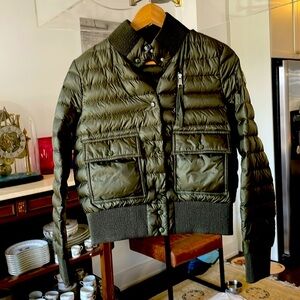 Moncler green puffer jacket.Comes with a pouch.